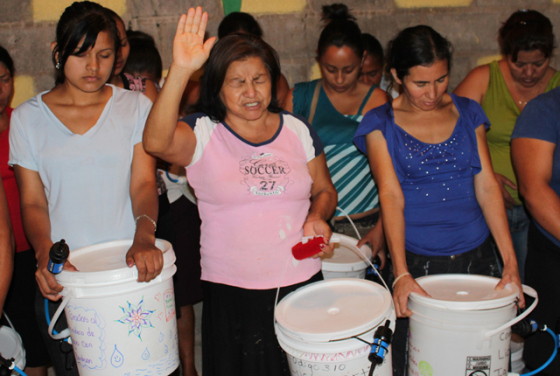Honduran women prayed and offered thanks to God during their training to use the systems. Photo Special to The Record